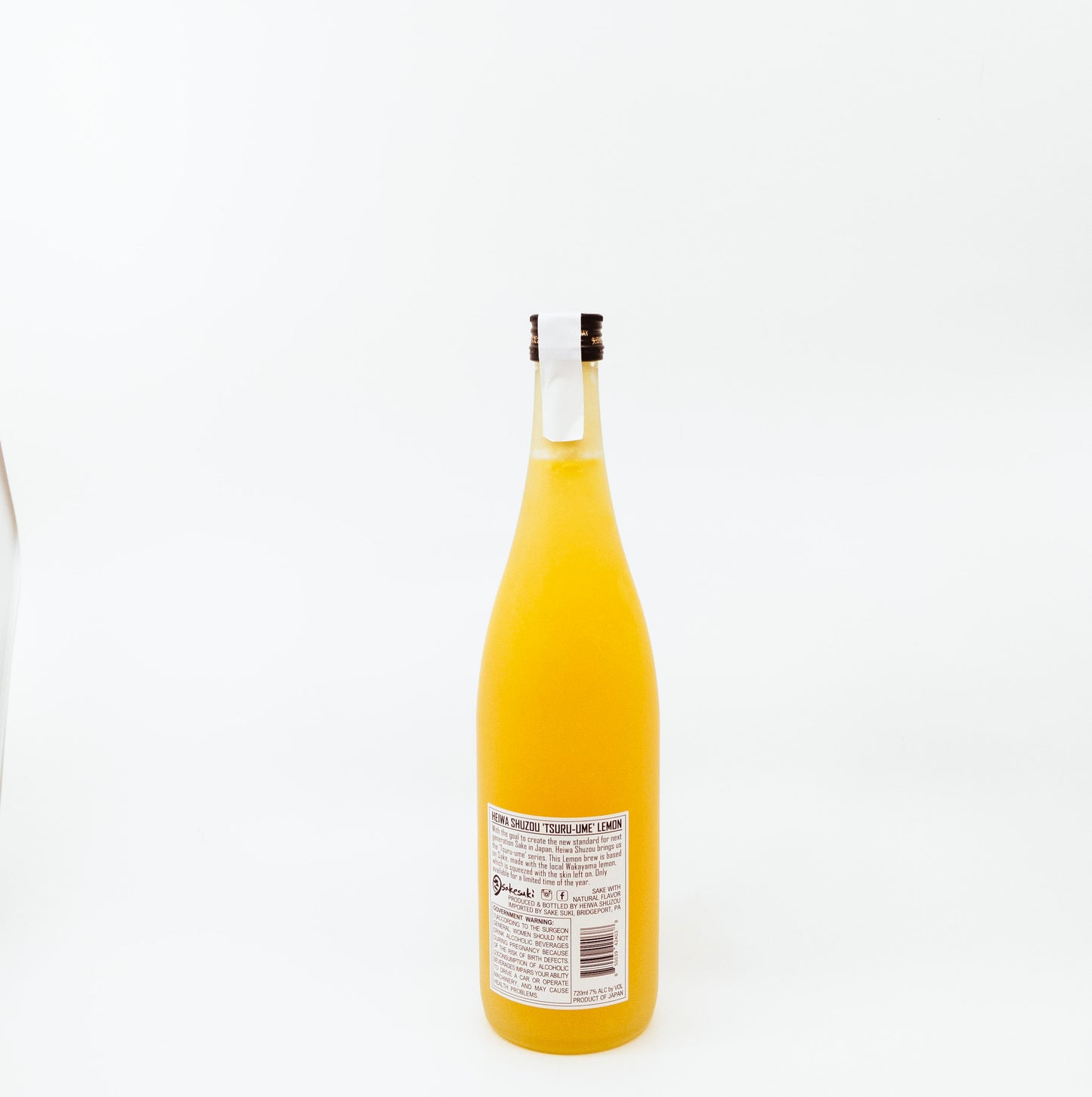 back of yellow glass bottle