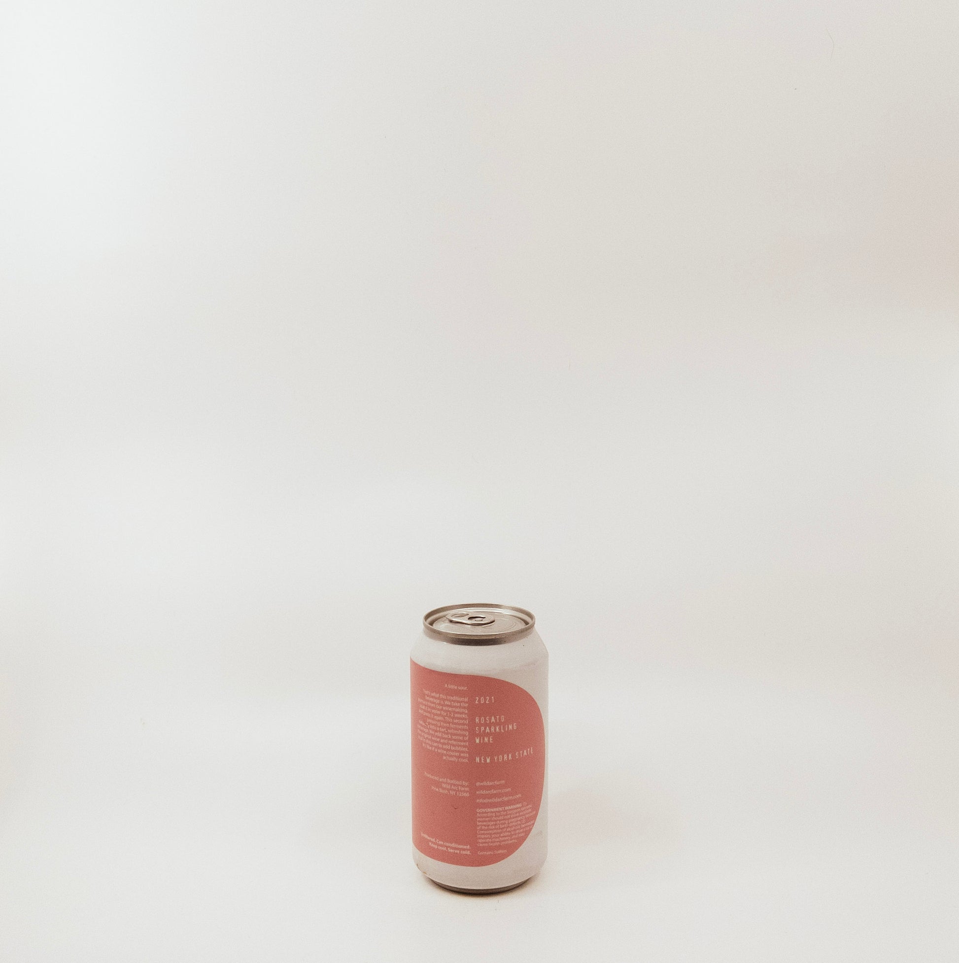 back of metal can with pink graphic