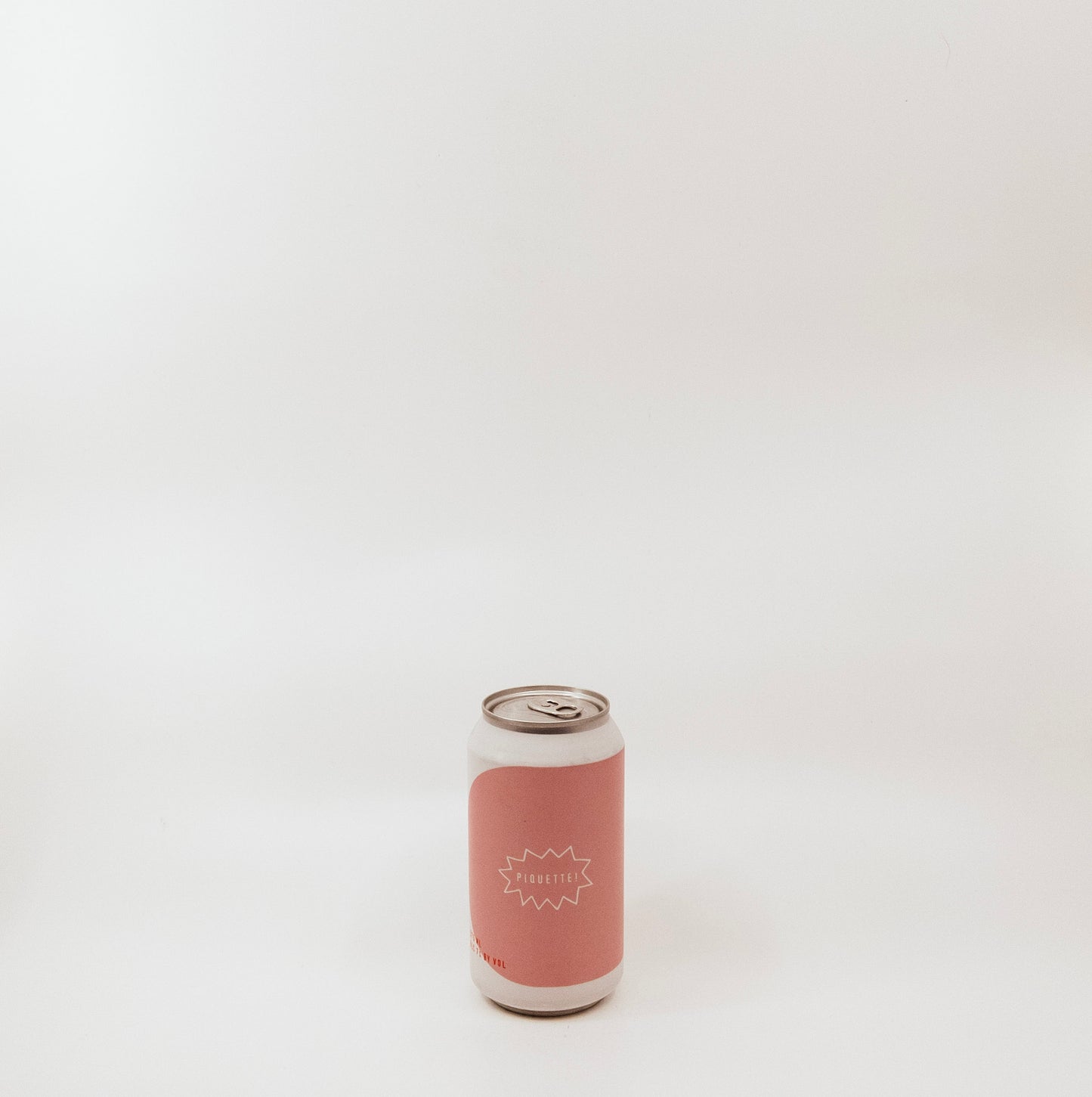 metal can with pink graphic