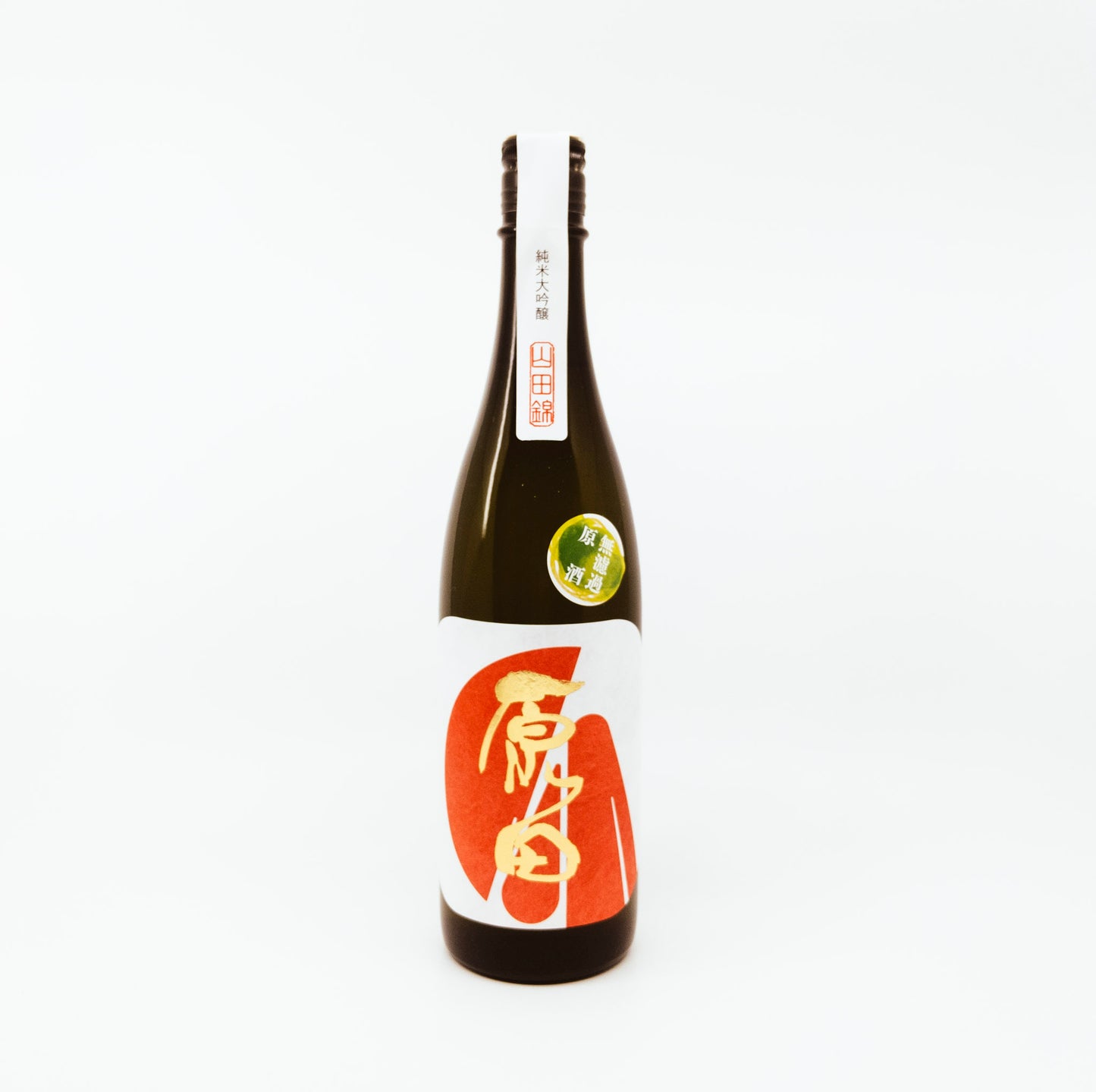 dark bottle with gold writing and red shapes on white label