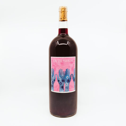 red wine bottle with blue hands on pink label