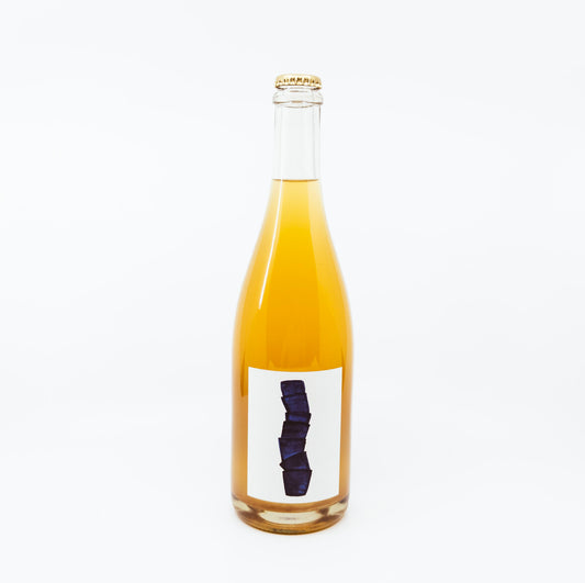 bottle with blue blocks on white label