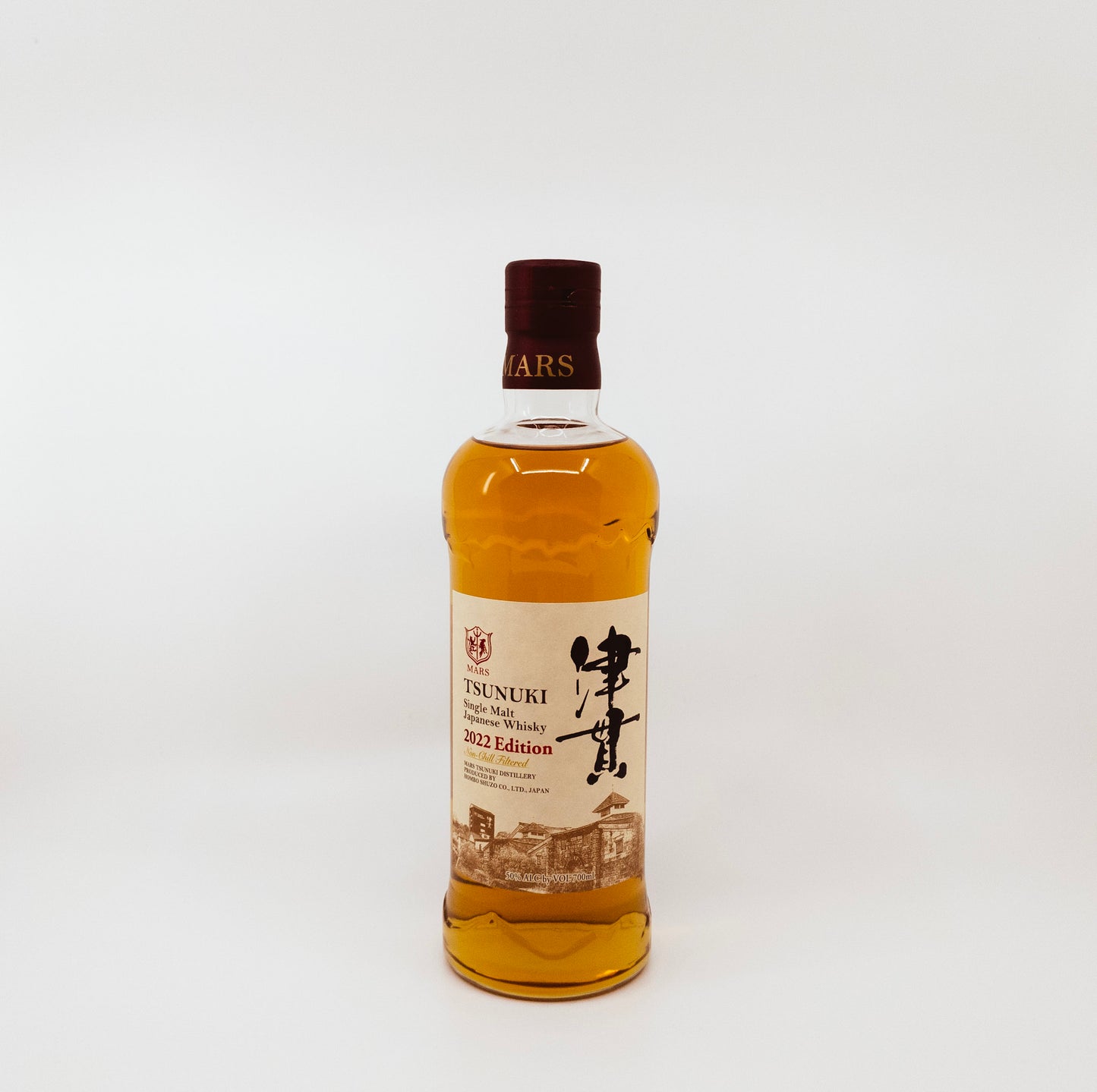 bottle with buildings on label