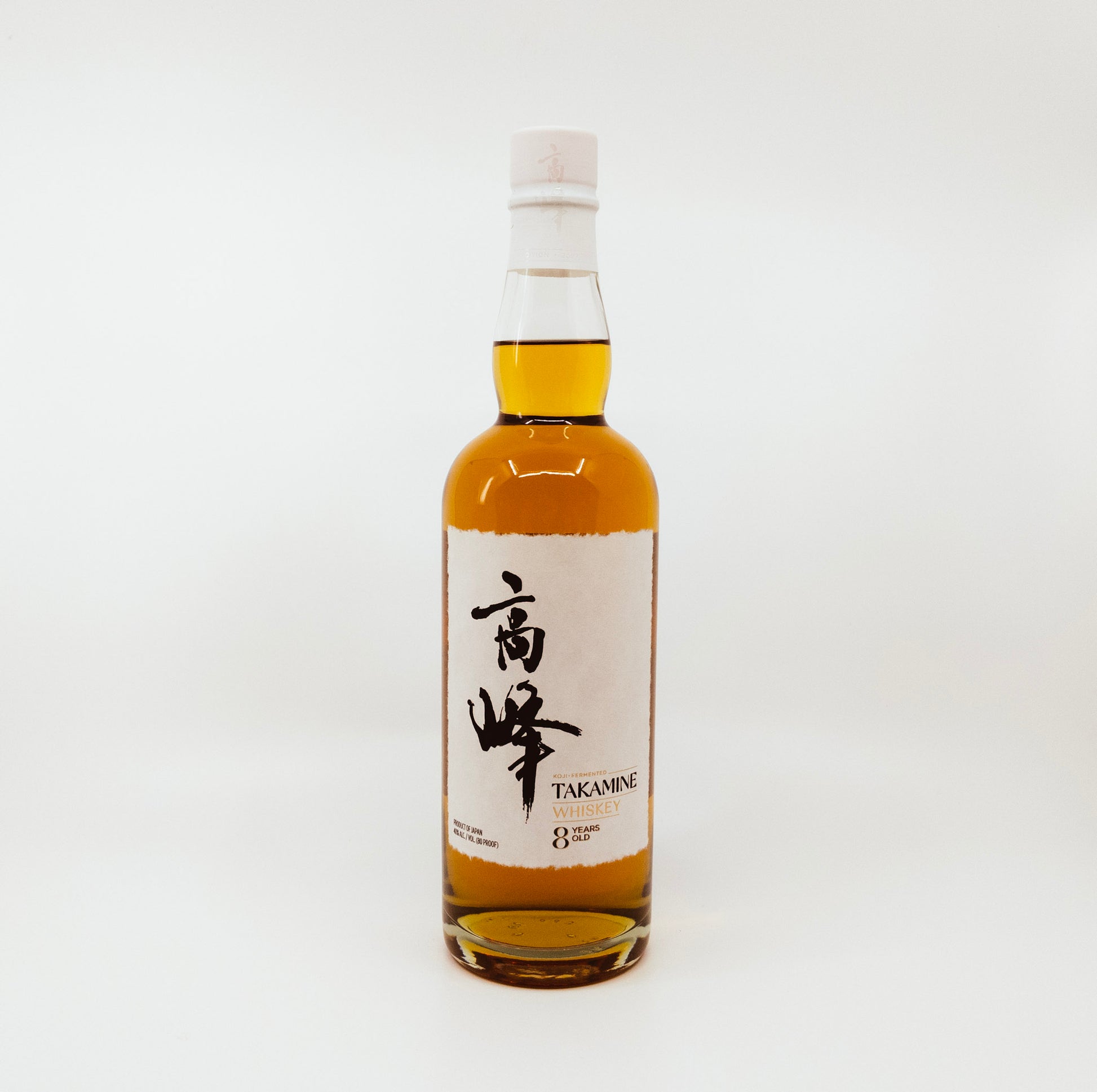 bottle with white label and white topper