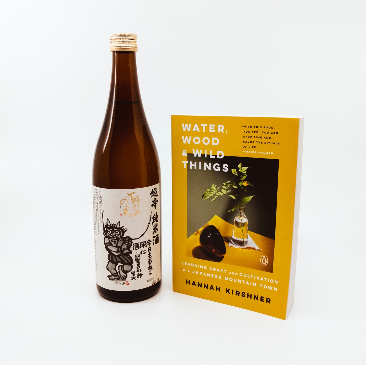 yellow book next to bottle of wine