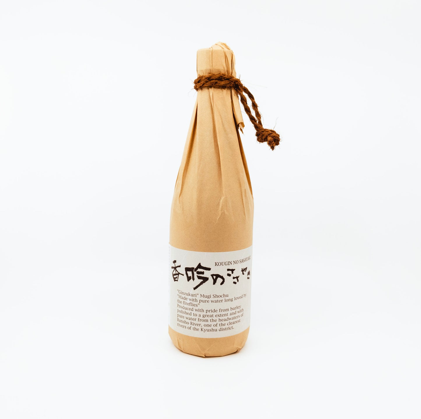 bottle wrapped in brown paper