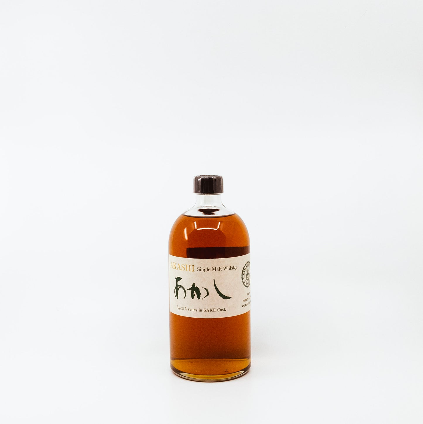 short glass bottle with cream label