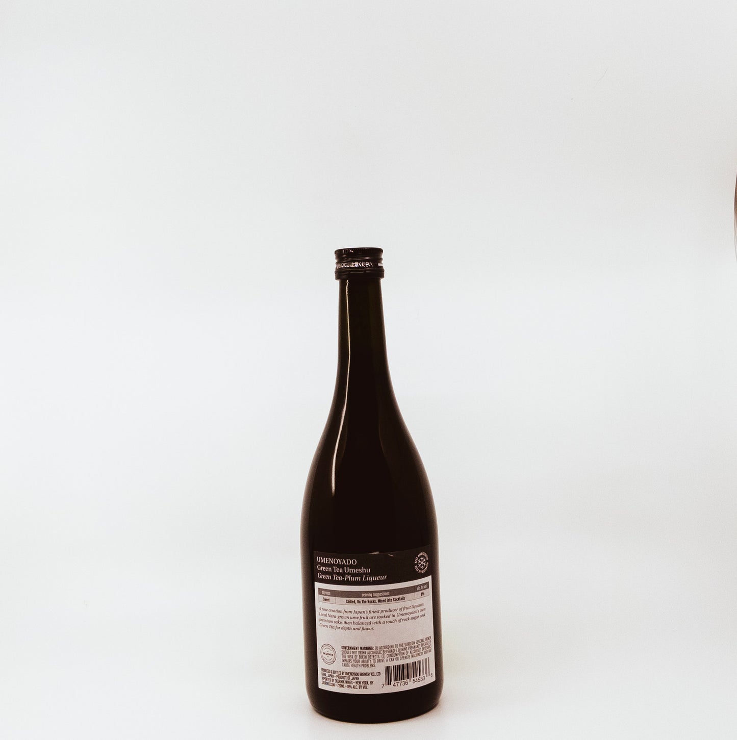 back of dark wine bottle with green label