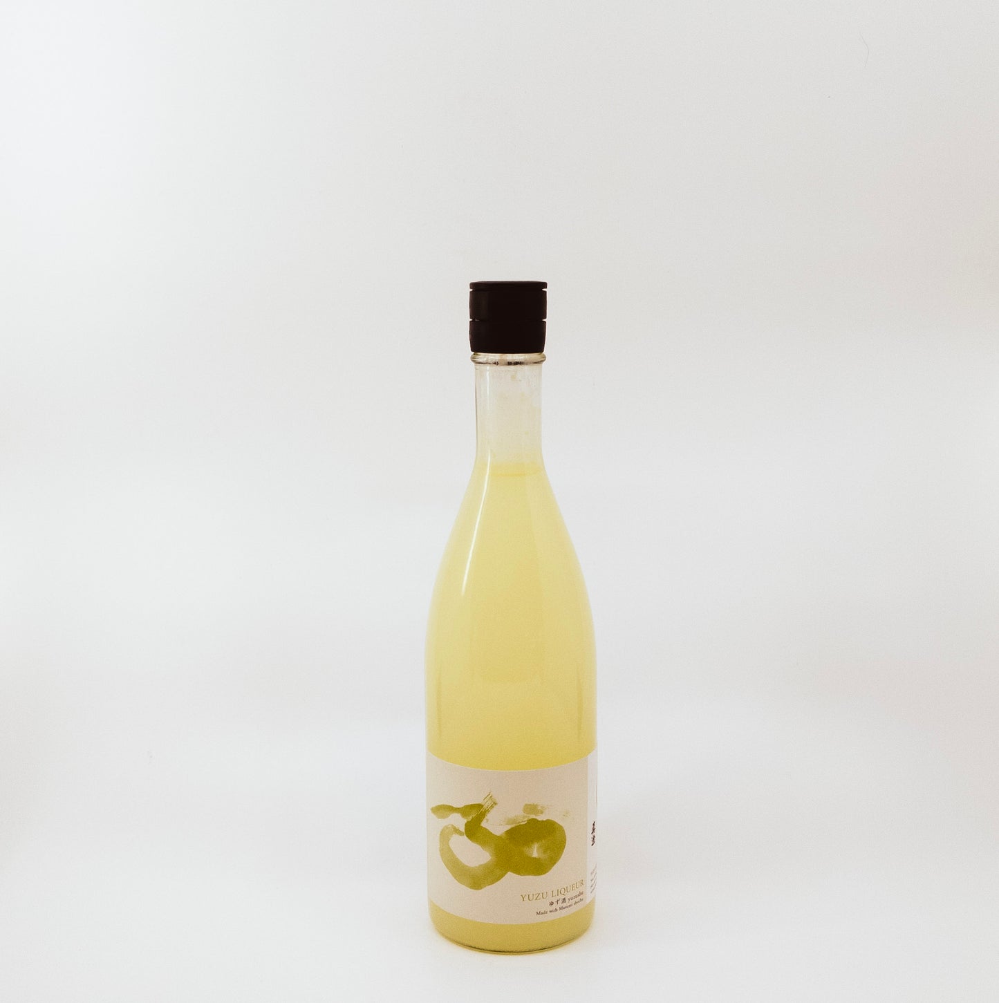 yellow glass bottle with white and yellow label