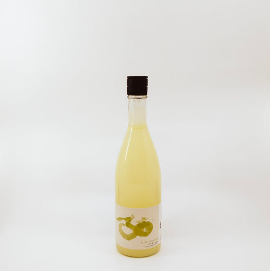 yellow glass bottle with white and yellow label