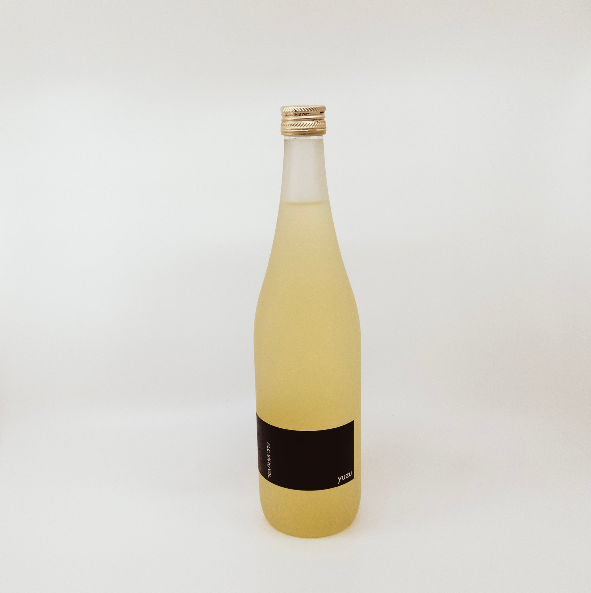 cream colored bottle with black label