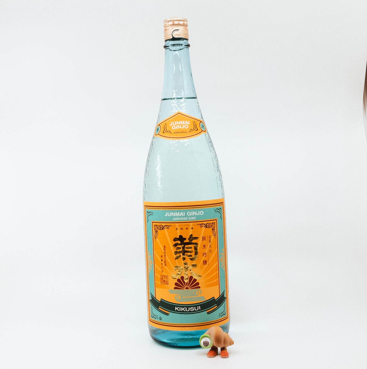 glass bottle with orange and teal label