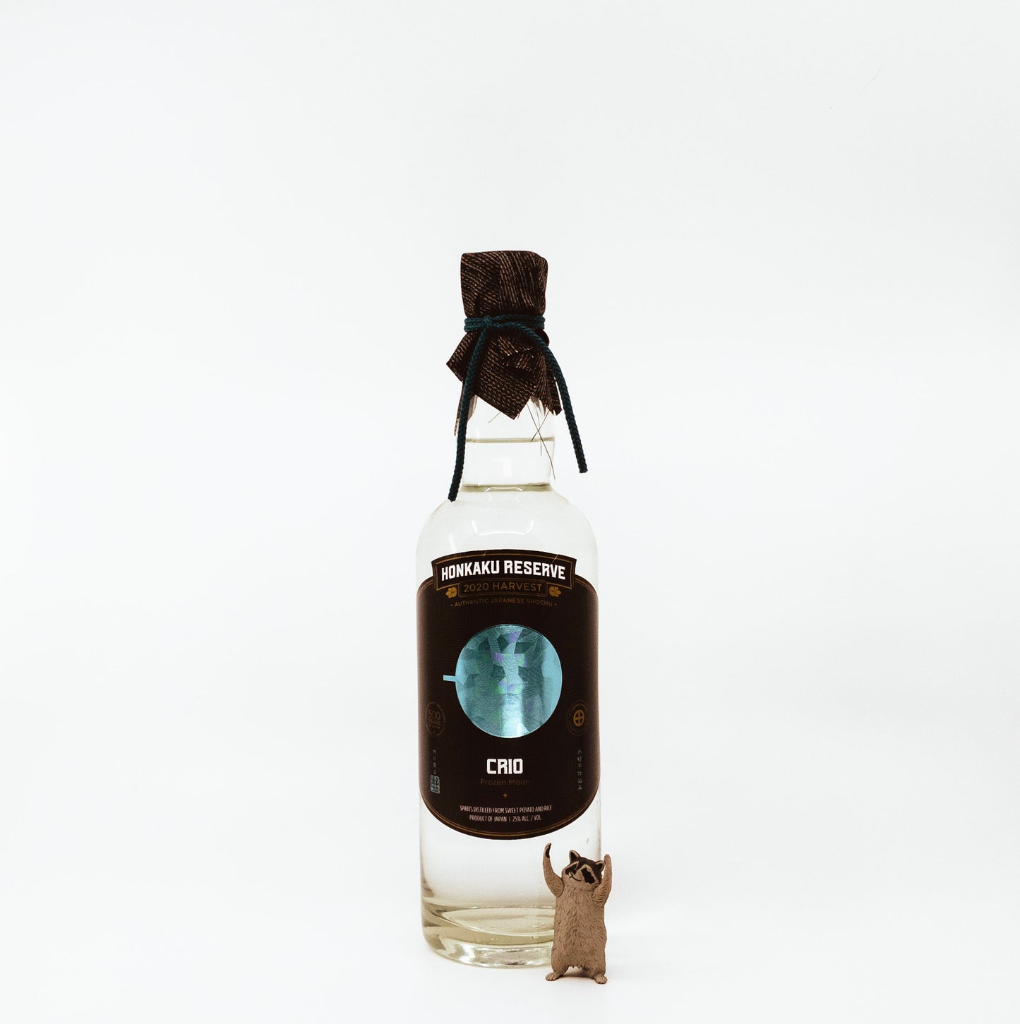 glass bottle with black topper and black label