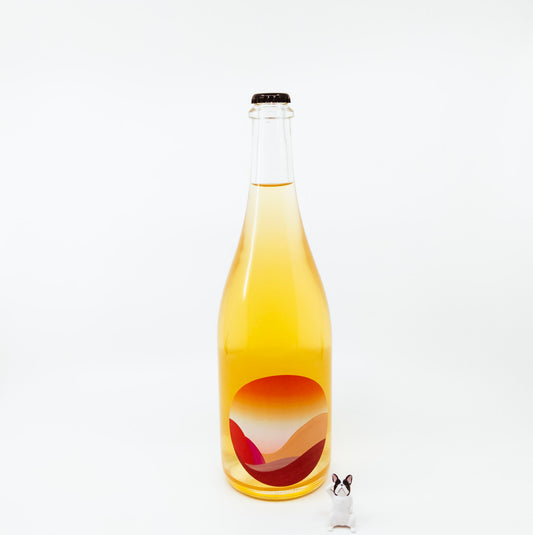 yellow glass bottle with sunset on circle logo