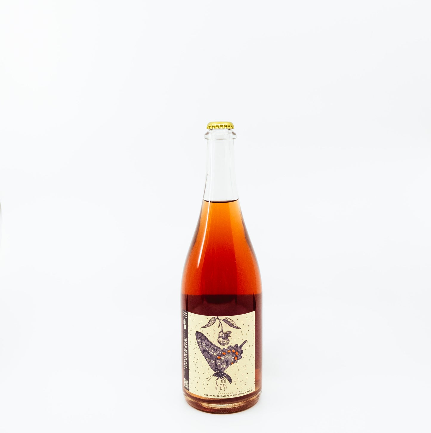 red glass bottle with moth on label