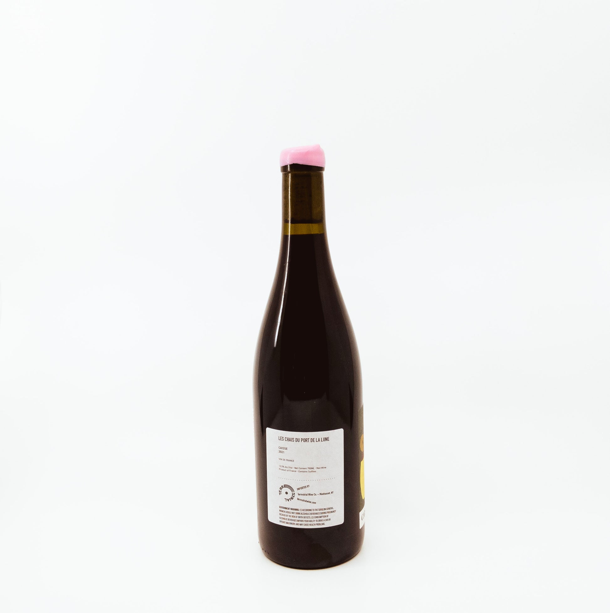 back of wine bottle with pink topper