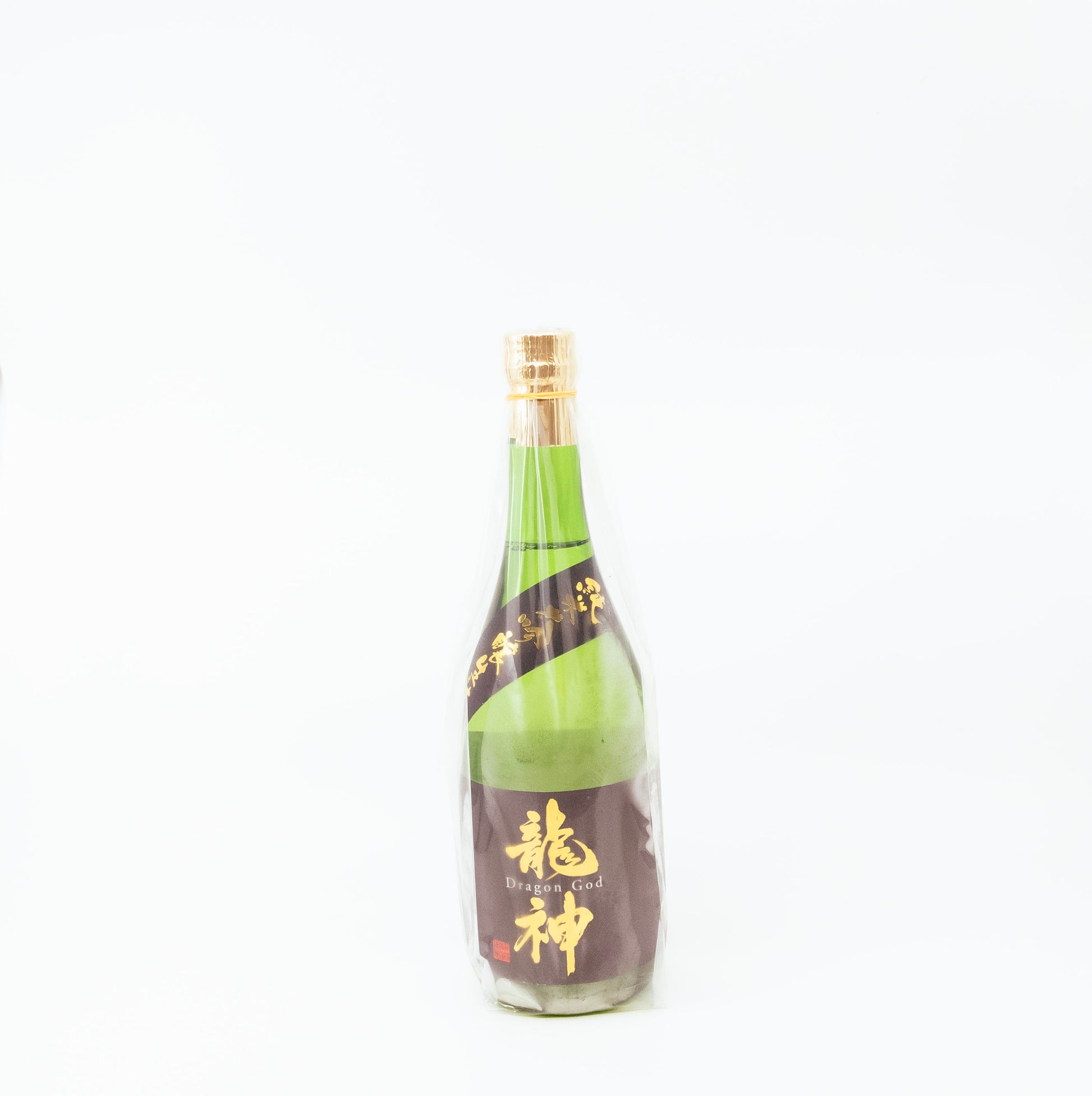 glass bottle wrapped in cellophane