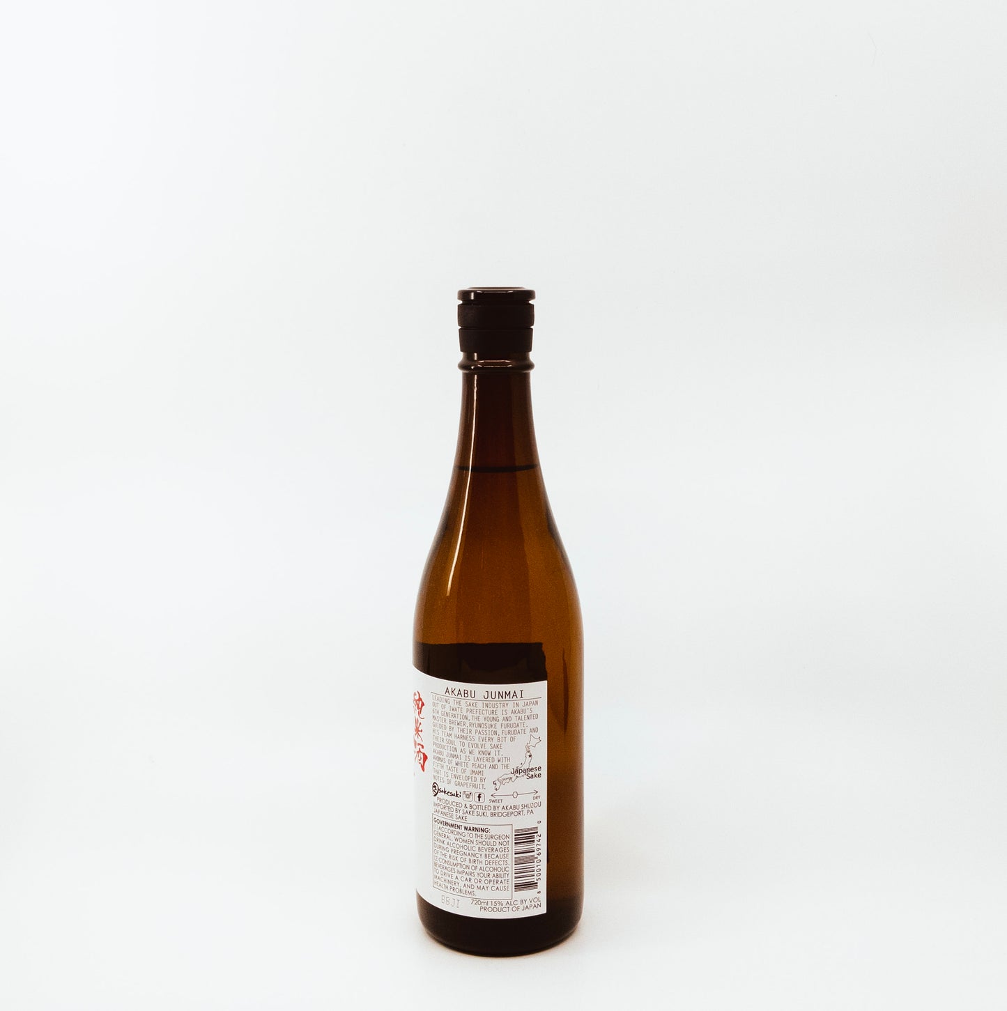 back of dark red glass bottle with red and white label