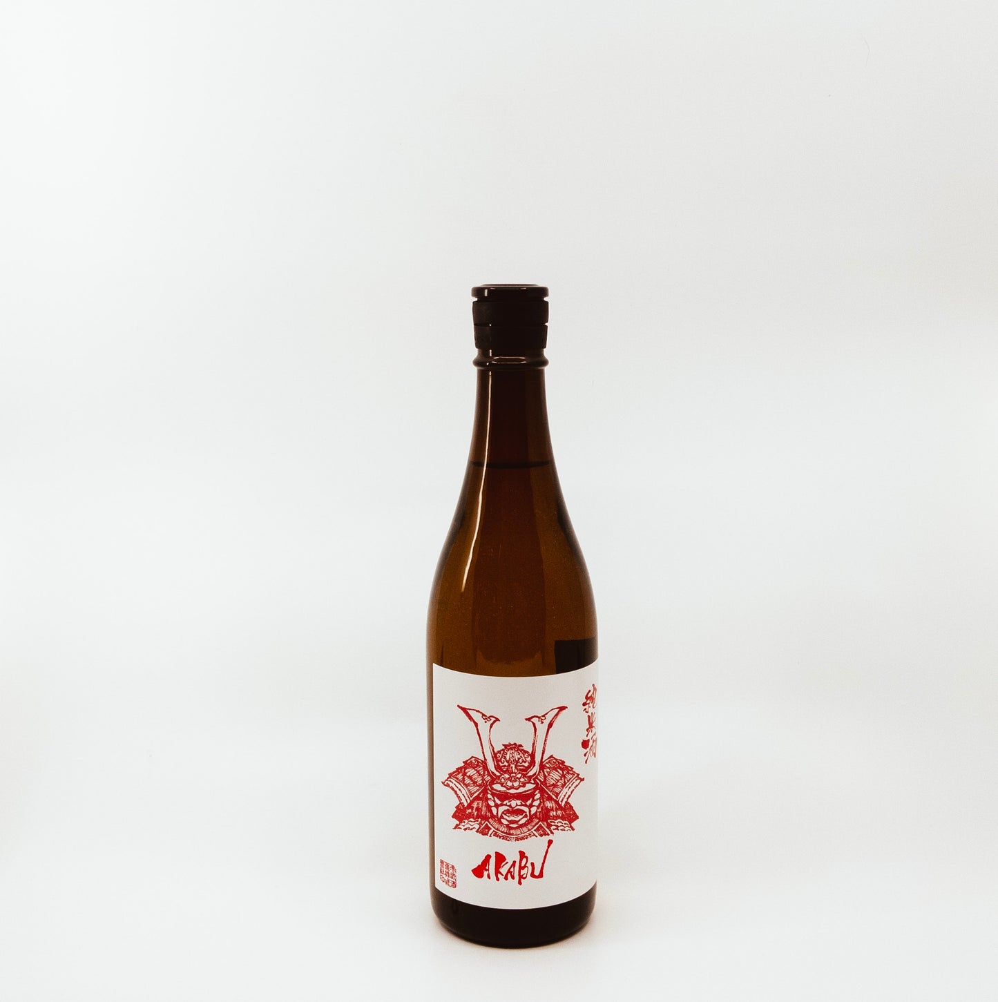 dark red glass bottle with red and white label