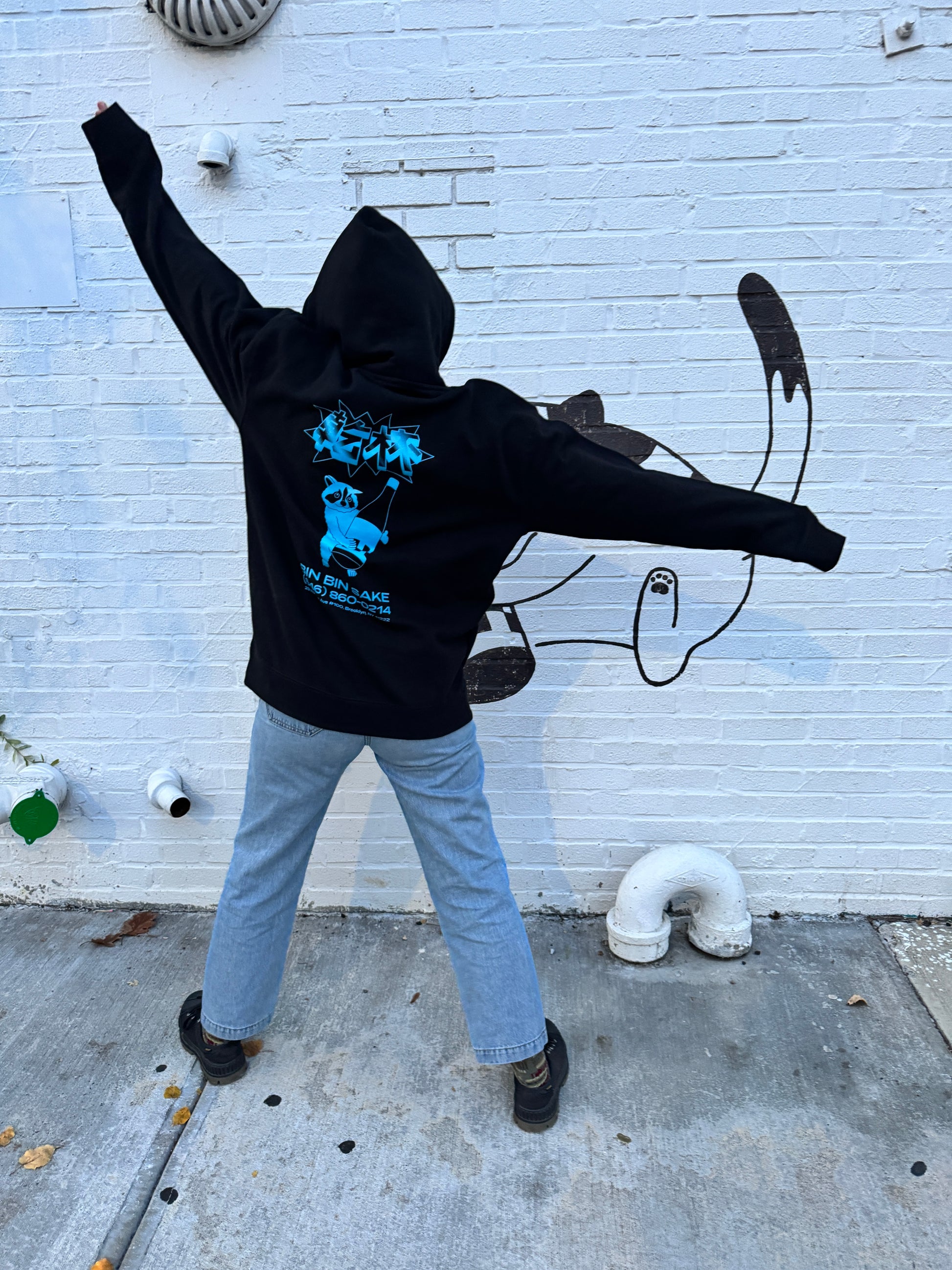 man in black bin bin sake hoodie