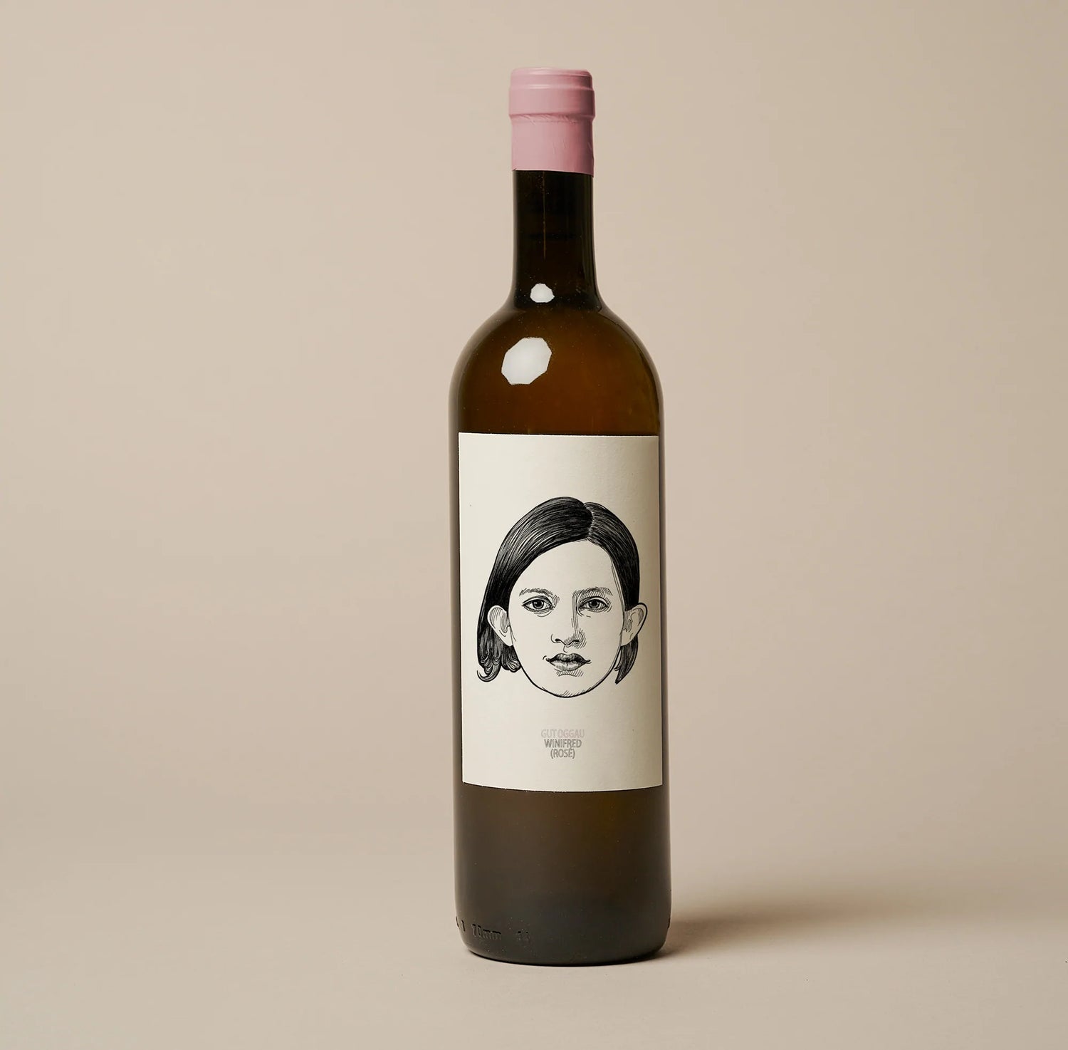 wine bottle with a female face on label