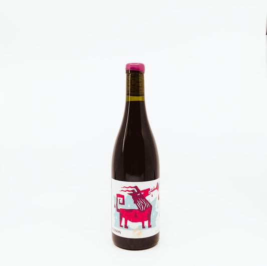 bottle with pink goat on label and pink topper