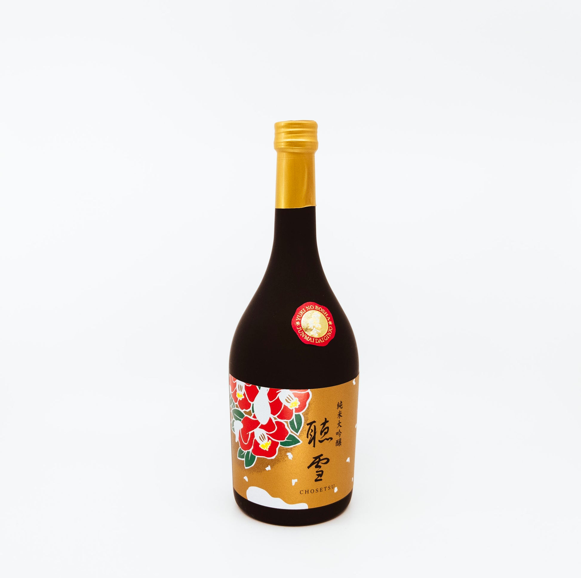 dark bottle with red flowers on gold label