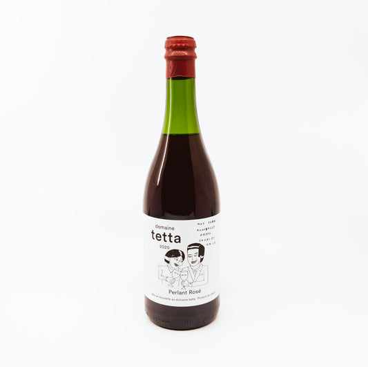 green bottle of tetta with red topper