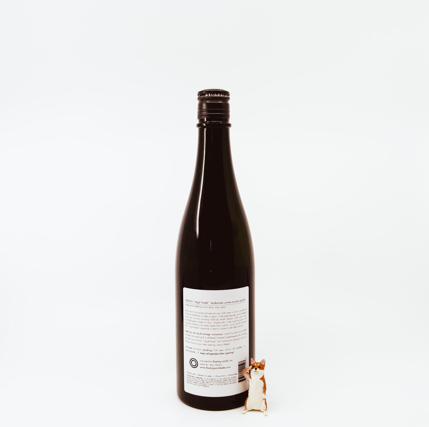 back of bottle next to fox figurine