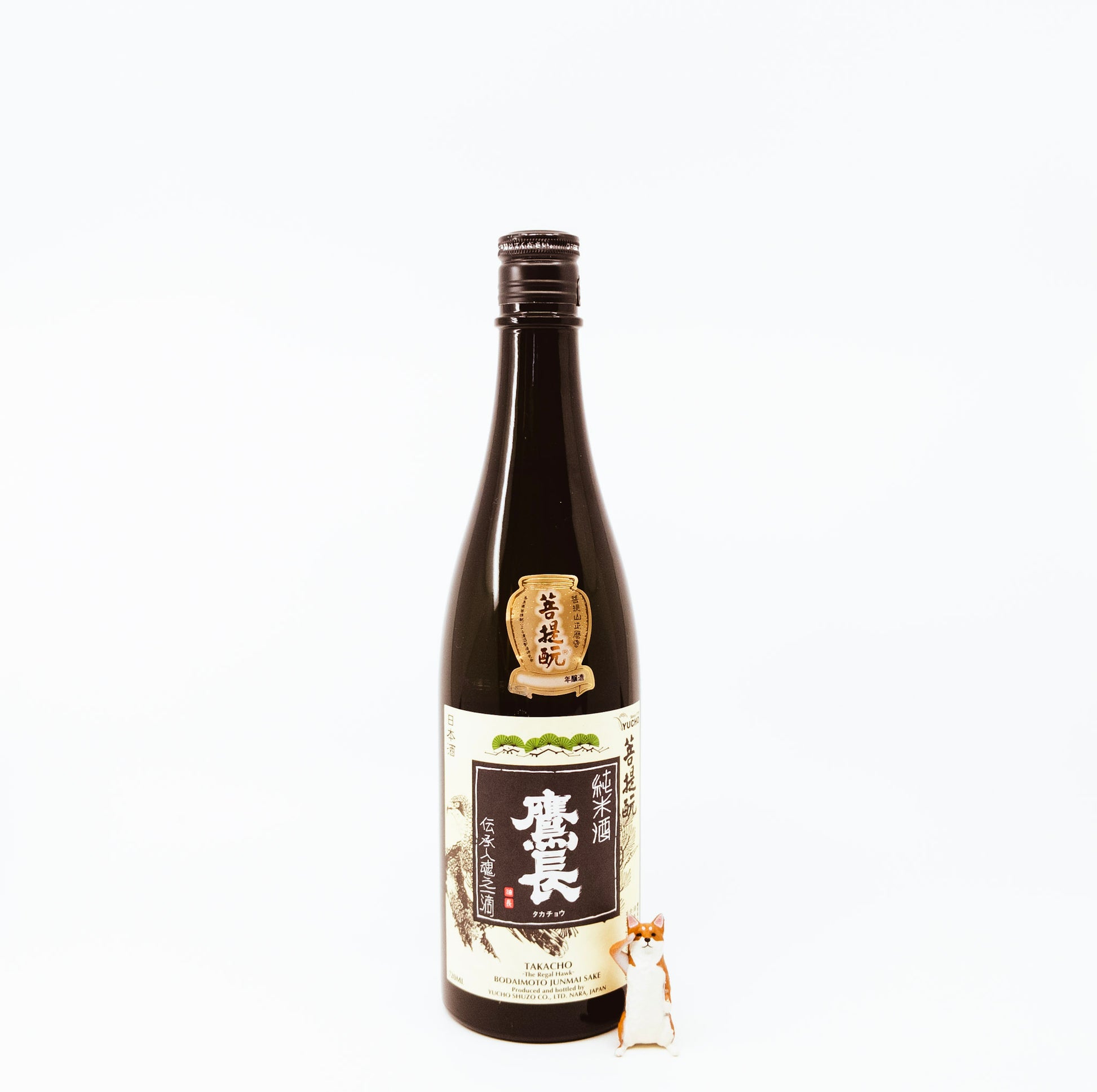 bottle next to fox figurine