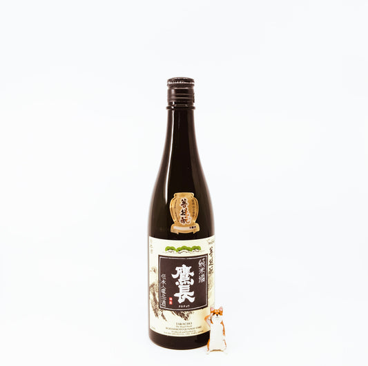 bottle next to fox figurine