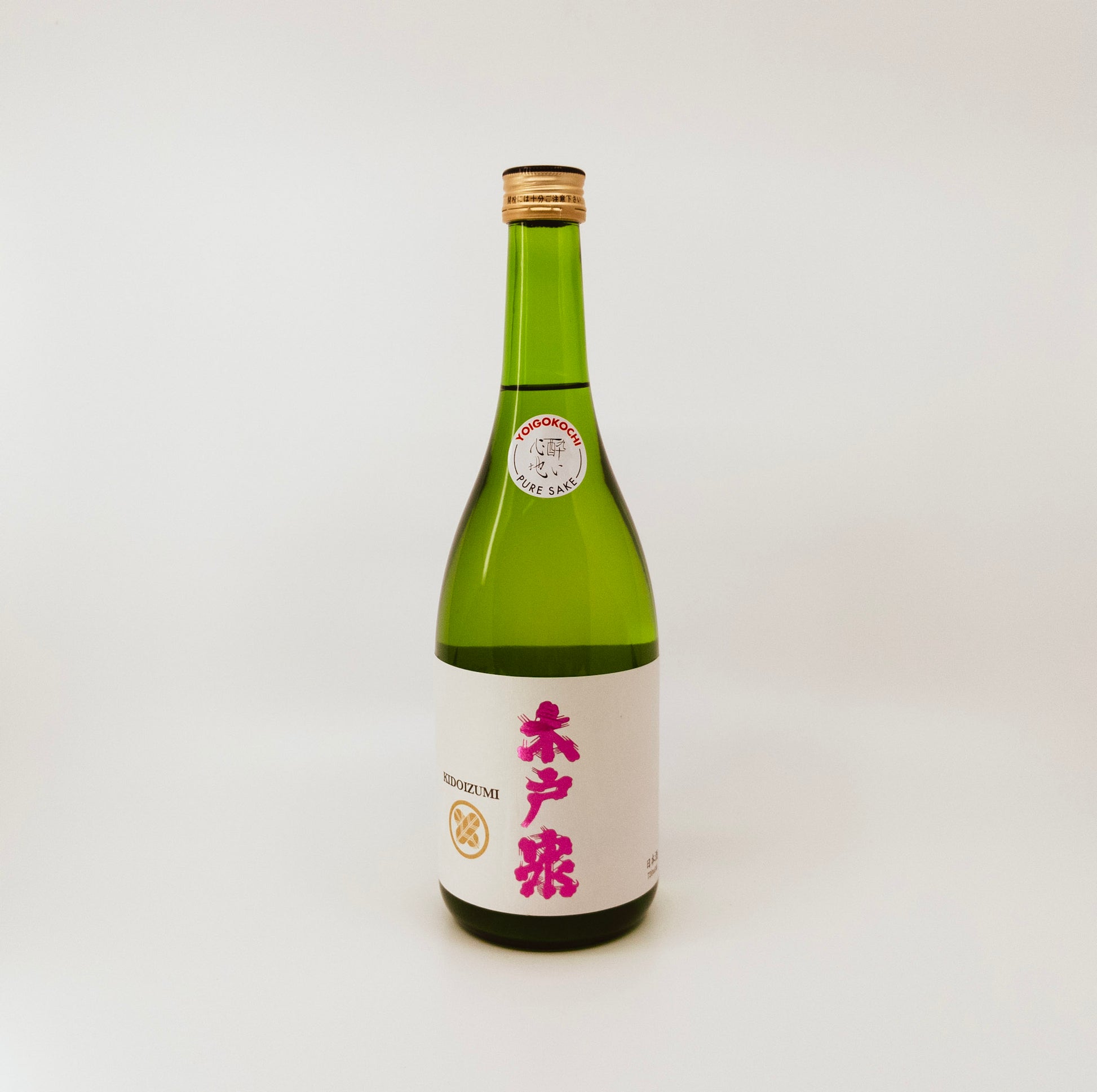 green bottle with pink writing on label