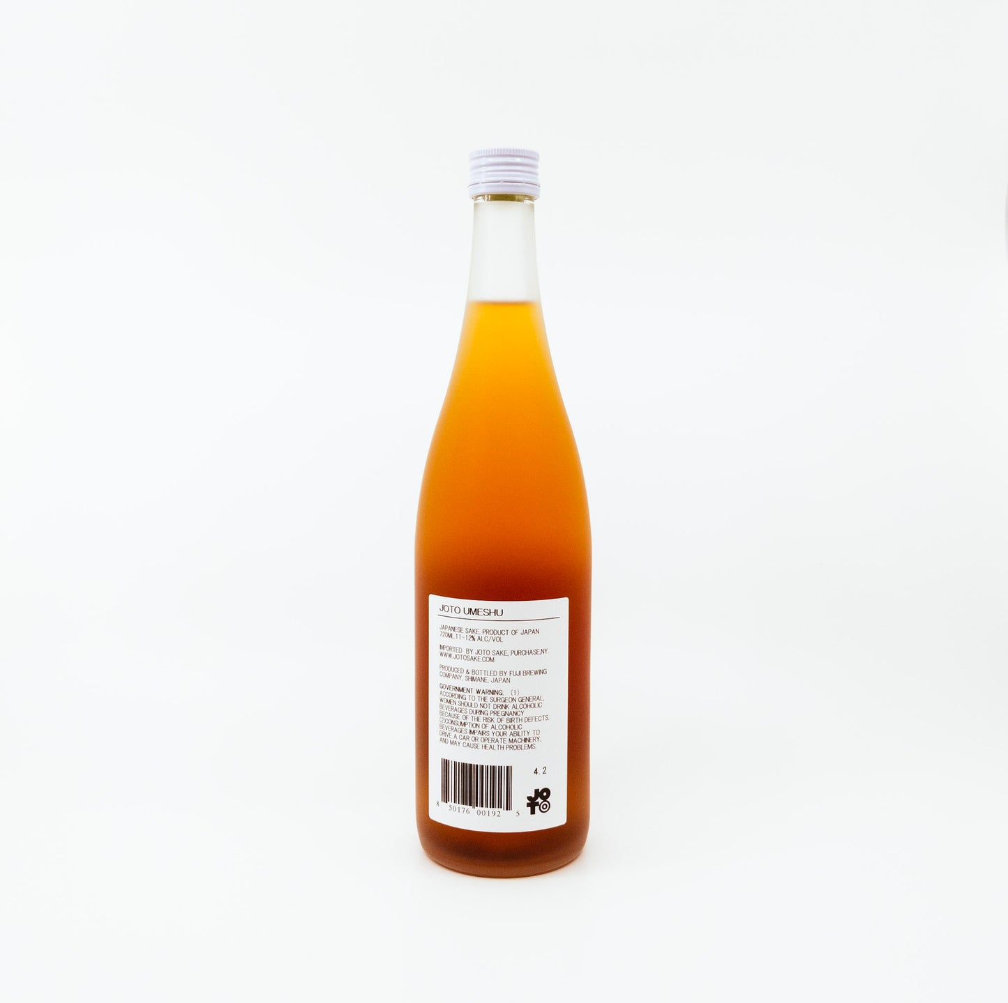 back of orange glass bottle with orange flower on label