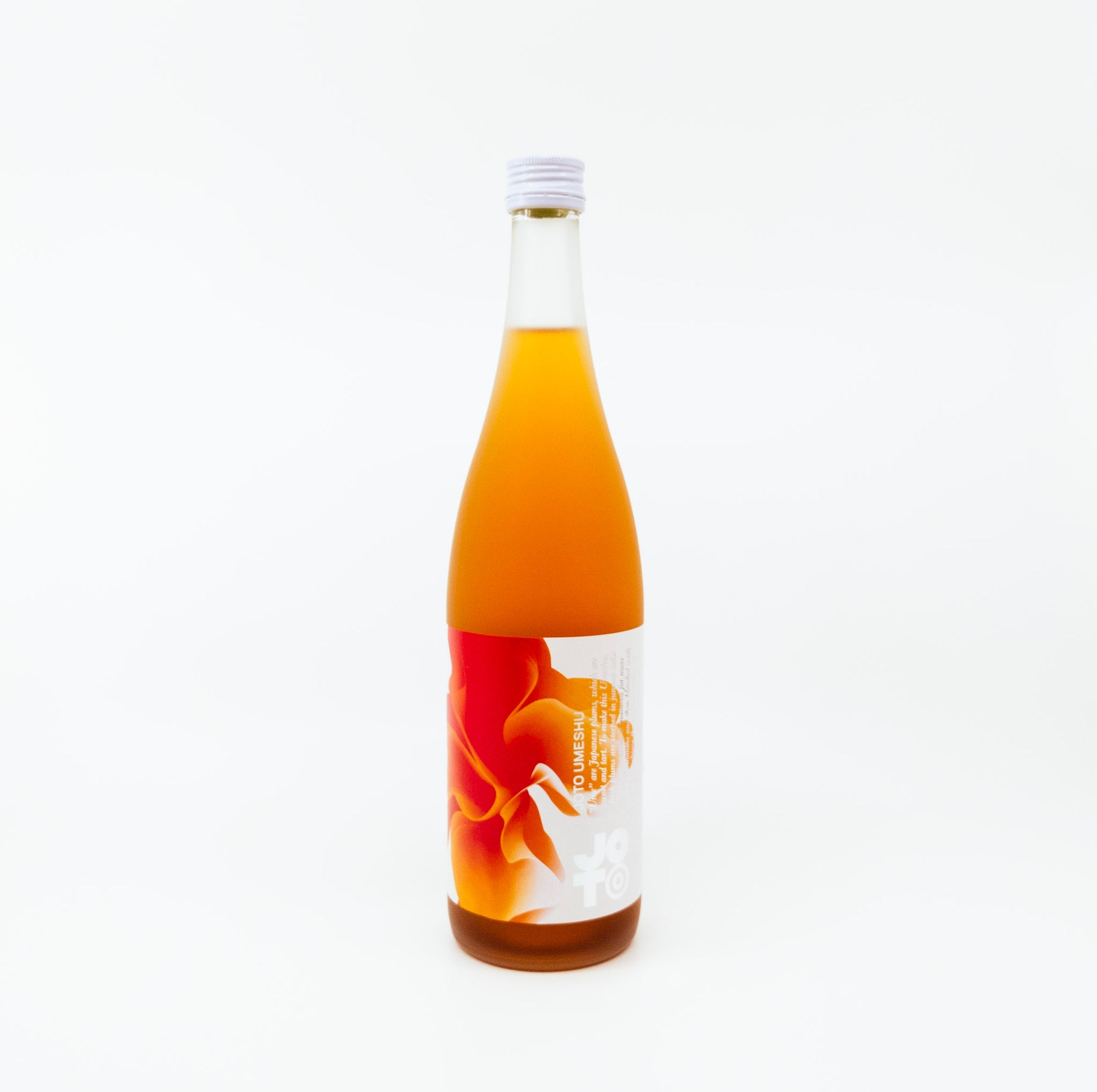 orange glass bottle with orange flower on label