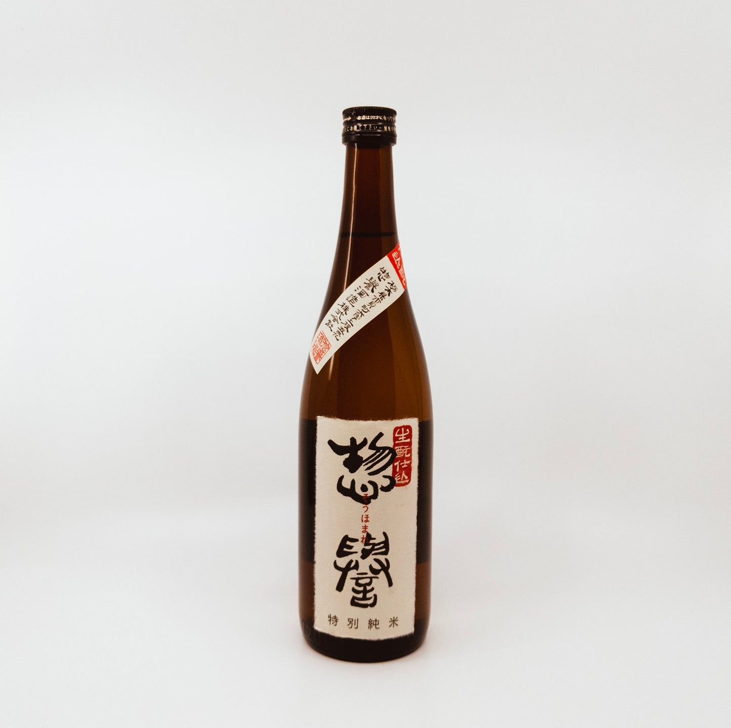brown bottle with cream label