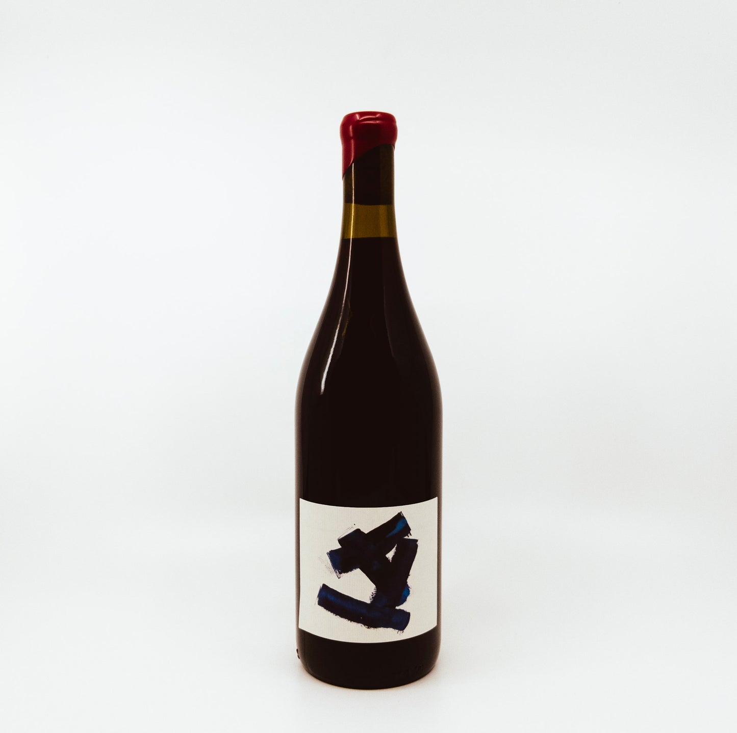 black bottle with black rectangles on white label