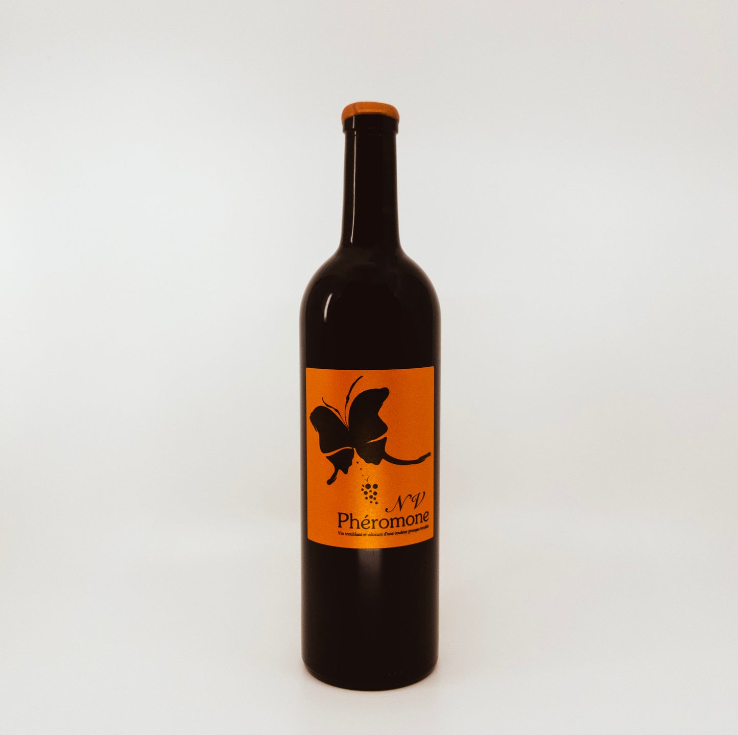 bottle with butterfly on orange label 