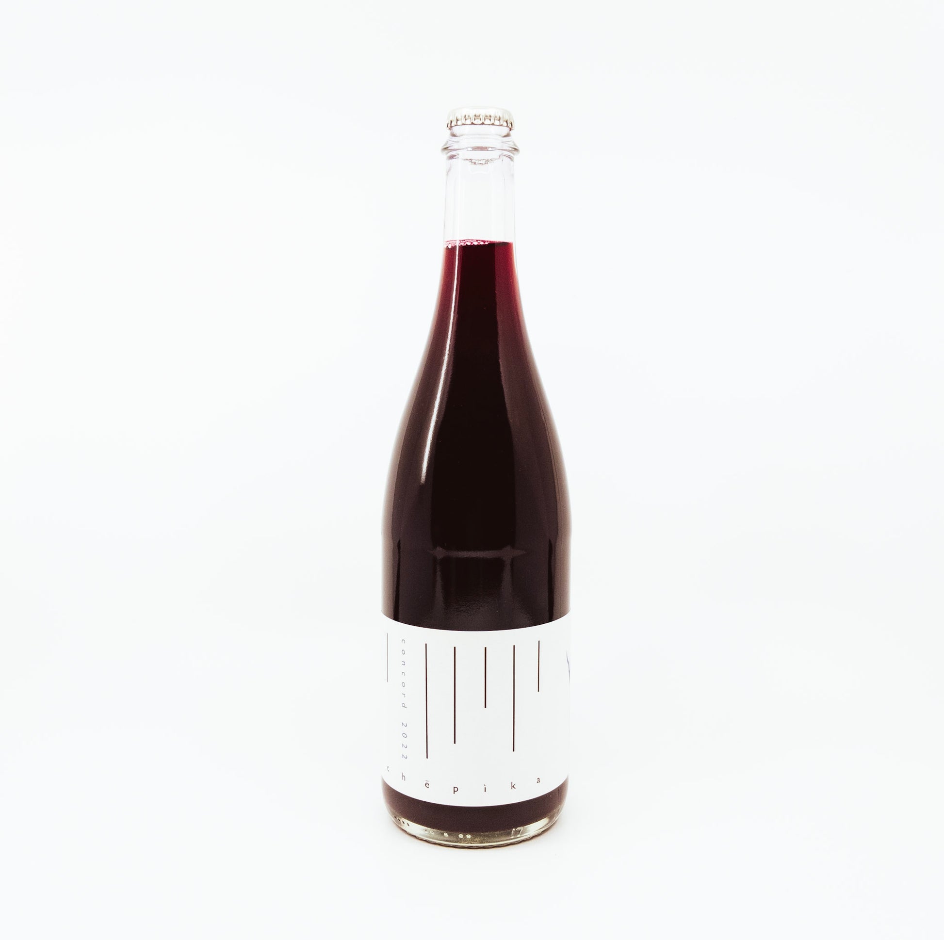 red wine in glass bottle with white label