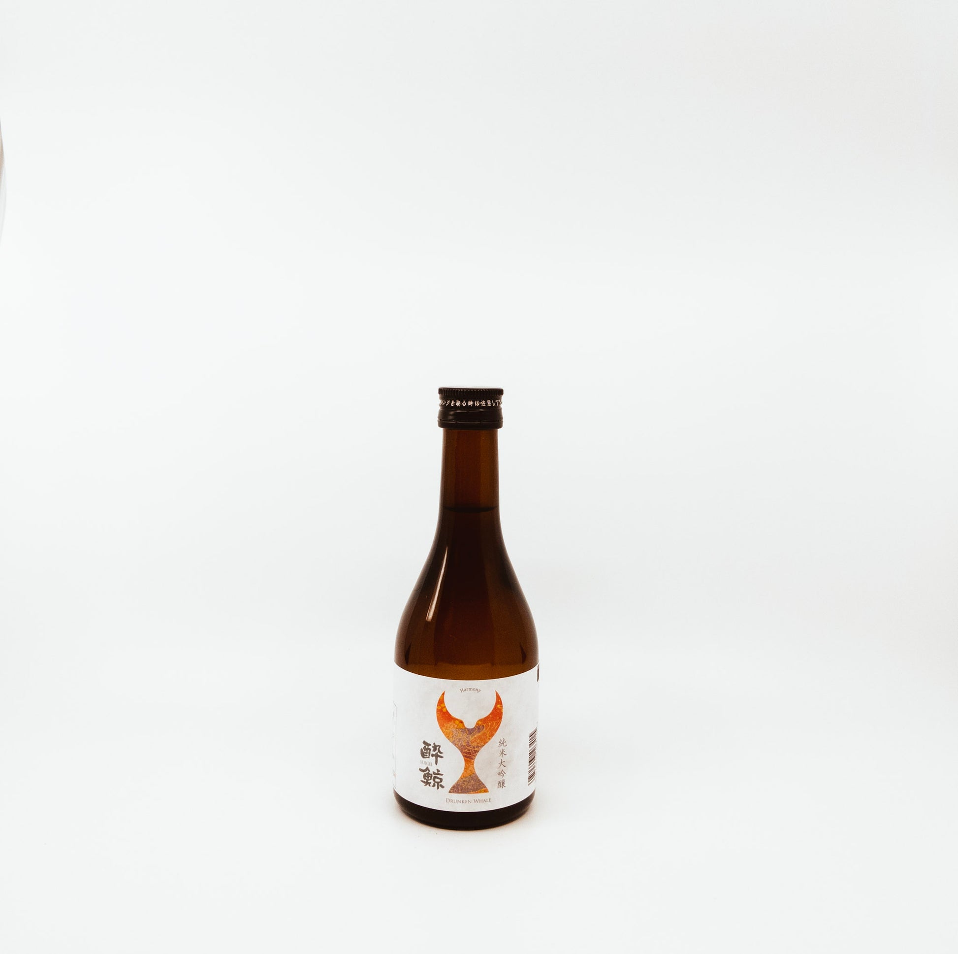 short brown bottle with mermaid tail on label