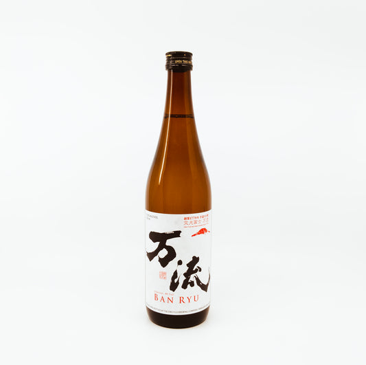 brown bottle with black writing on white label