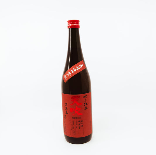 black bottle with red label and red cap
